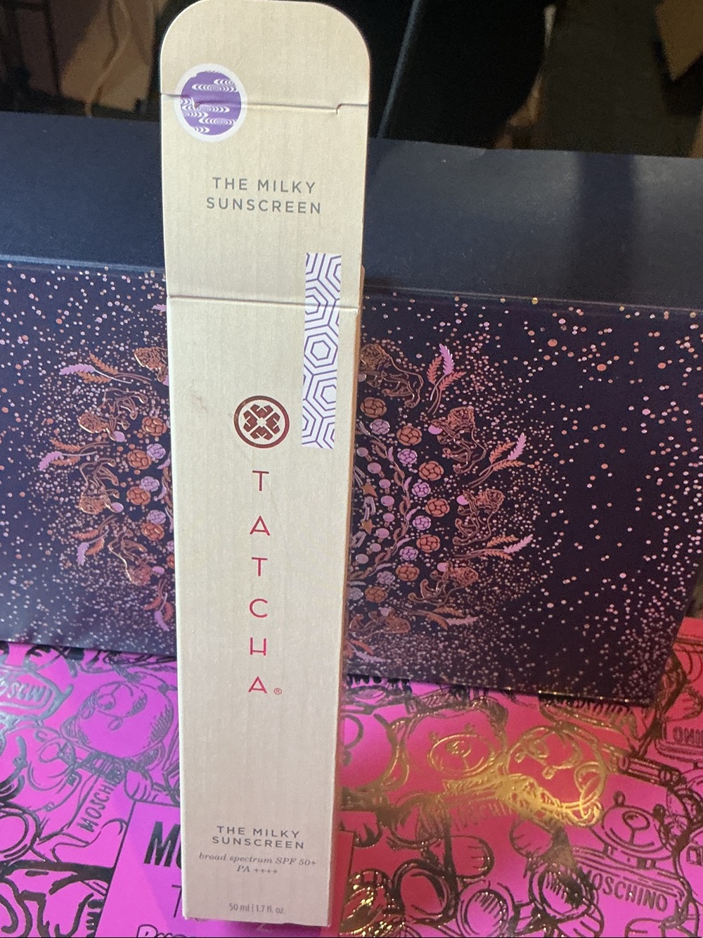 Tatcha The Milky Sunscreen – Cream and Purple Accents